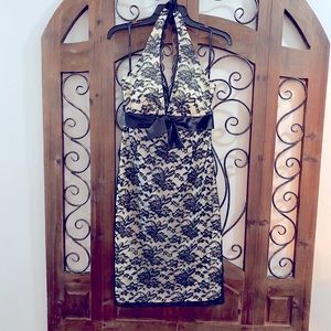 Ivory dress with black lace overlay. Ribbon-tie.